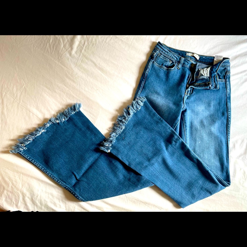 Nature flare jeans with distressing at hem. Size 5.